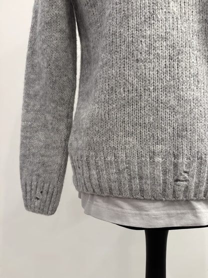 Cardigan in lana con rotture