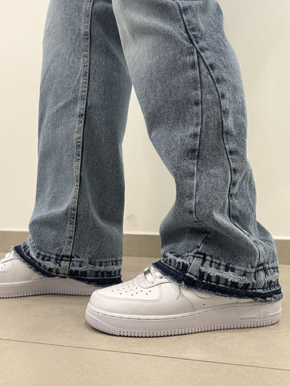 Jeans chiaro baggy con fondo graffiato