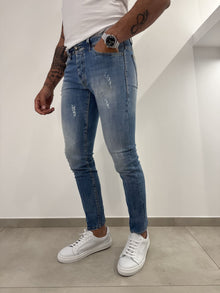 Jeans slim uomo strappato