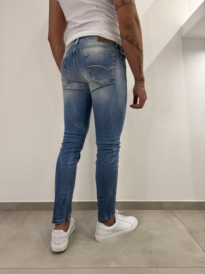 Jeans slim uomo strappato