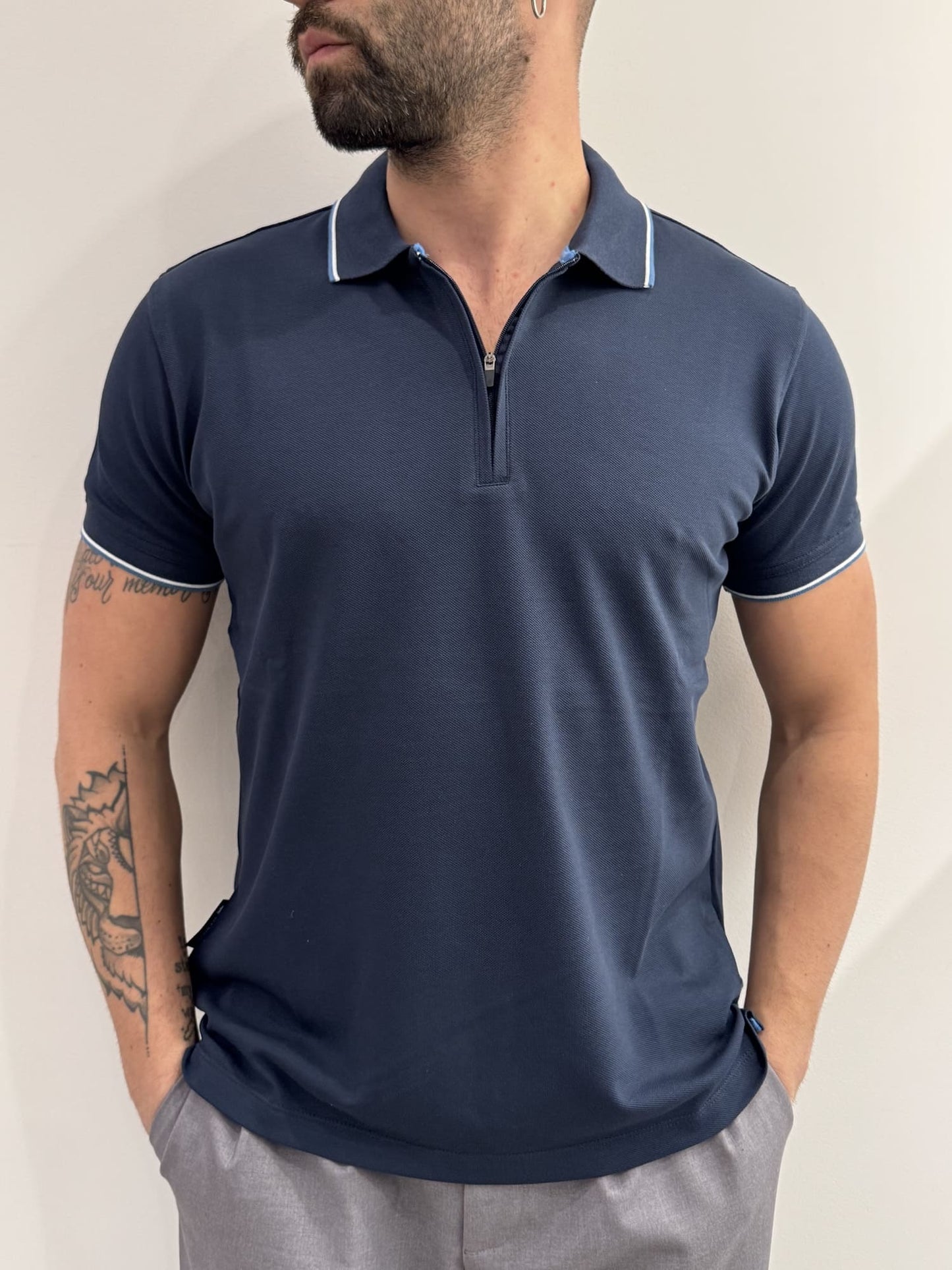 Polo in piquet con mezza zip