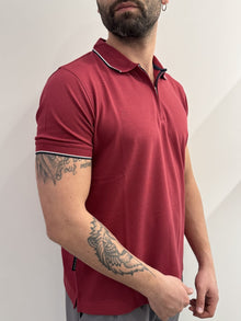 Polo in piquet con mezza zip