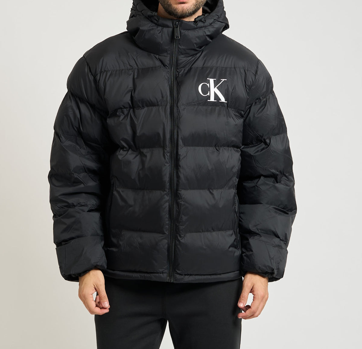 Piumino con monogramma Calvin Klein