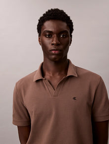 Polo in piqué di cotone con colletto aperto Calvin Klein