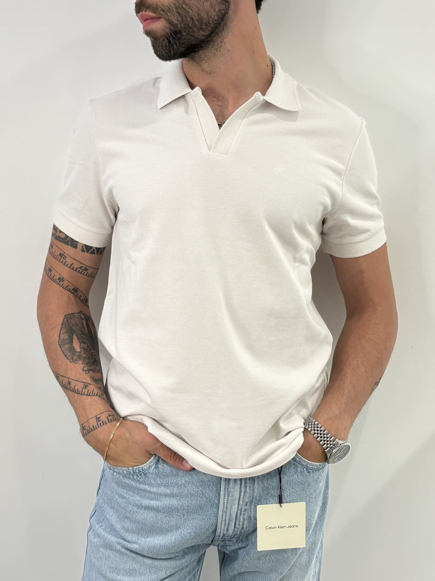 Polo in piqué di cotone con colletto aperto Calvin Klein