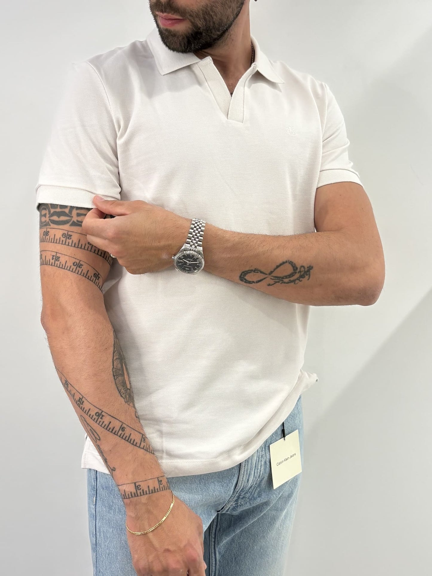 Polo in piqué di cotone con colletto aperto Calvin Klein
