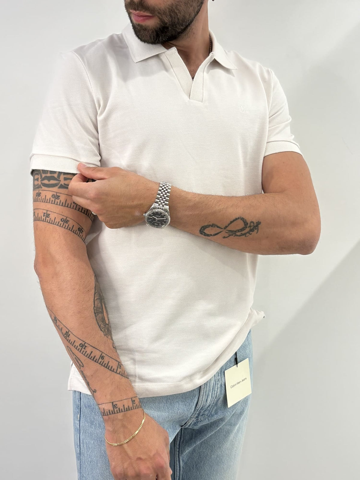 Polo in piqué di cotone con colletto aperto Calvin Klein